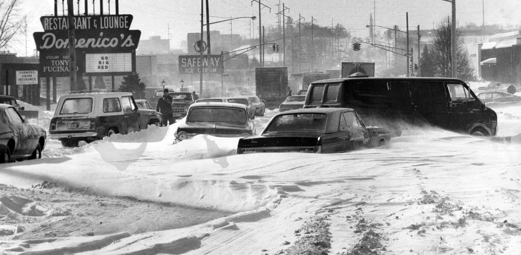 These vehicles were stalled on 72nd Street, south of Dodge. Domenico's Restaurant survived the blizzard, but was destroyed in the tornado in May, just a few months later.